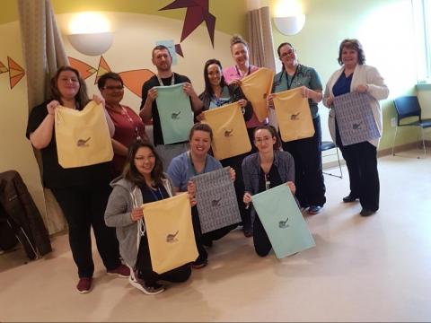 Nunavut Healthcare workers holding laundry bags-- group picture 