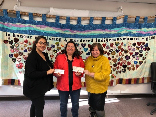 Native Women Association's Amanda Baton and Yvonne Hopkins (left and right) and Chair of PSAC North NWT Women's Committee Geraldine Penney.