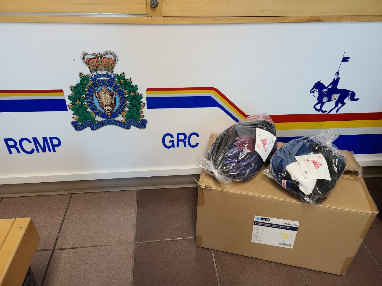RCMP sign and box of winter kits 